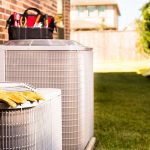 Image of AC with tools on it. Why Do I Need AC Maintenance Now?